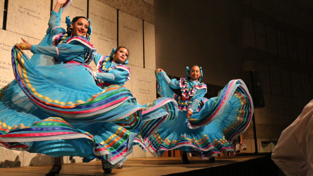 girls performing in cultural dance with beautiful colorful dresses